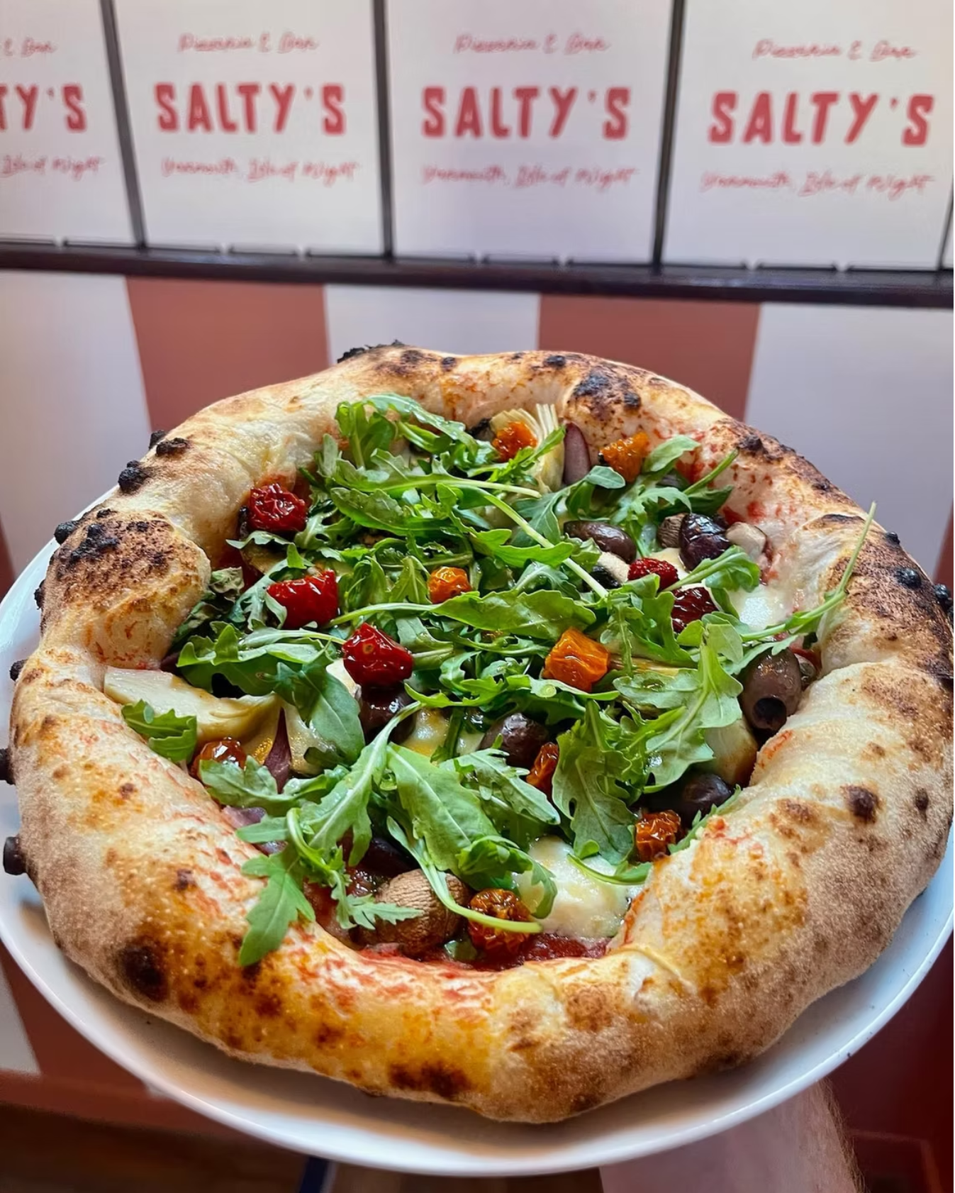 Pizza with rocket on top