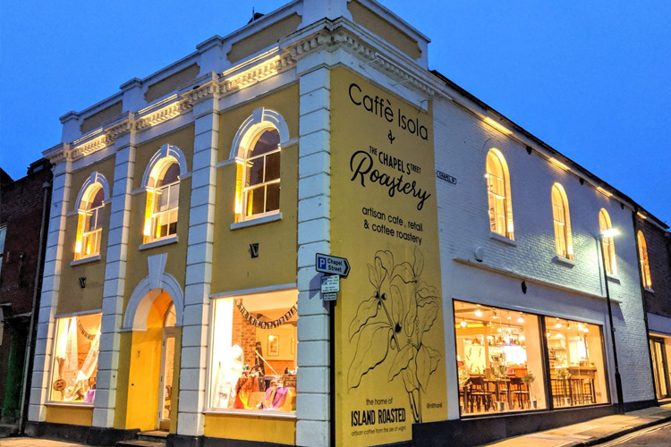 Big Yellow building on the corner of a street